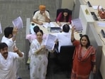 Congress and AAP councillors protesting in the Well of the House on Thursday. (Keshav Singh/HT)