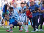 FILE - Argentina's Leandro Paredes (5) knocks down Spain's Gavi (9) during scuffle. 