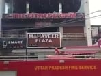 Five fire engines were rushed to the spot and it was found that five people were stuck on the terrace. (HT Photo)