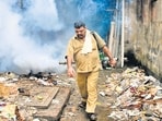 Mumbai...6th June 2011... News... Sanjay Jadhav, 46, a BMC worker fumigating the area with his TF35 Fogging Machine in the Aai Maai Merwanjee Lane in Parel area as a part of precautionary measures against Malaria during the monsoons - Photo by Kalpak Pathak (Hindustan Times)