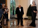 Former Secretary of State Henry Kissinger, left, and wife Nancy Kissinger arrive for a State Dinner at the White House, September. 20, 2019.