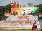 Children stand in a formation that reads "Vande Mataram" during the Independence Day celebrations at Red Fort.
