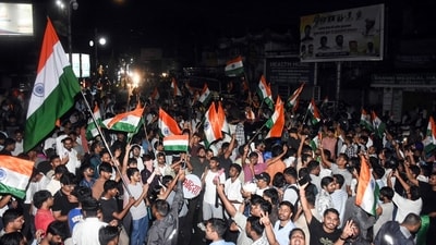 JPSC-JSSC aspirants wave the national flag as they celebrate after the Jharkhand government accepted their demands recently. (ANI)