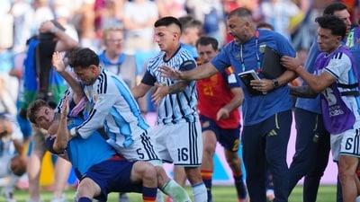 FILE - Argentina's Leandro Paredes (5) knocks down Spain's Gavi (9) during scuffle. (AP Photo/Julio Cortez) FILE - Argentina's Leandro Paredes (5) knocks down Spain's Gavi (9) during scuffle. (AP Photo/Julio Cortez)