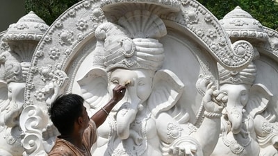 Gram it: Weeks ahead of the Ganesh Chaturthi festival, a 25-year-old artist Ram Babu from Barmer district in Rajasthan works on a 12-foot-tall idol of Lord Ganesha, on Old MG Road near Government Girls College in Gurugram. Delhiites are waiting for the festival to arrive! (Photo: Parveen Kumar/Hindustan Times)