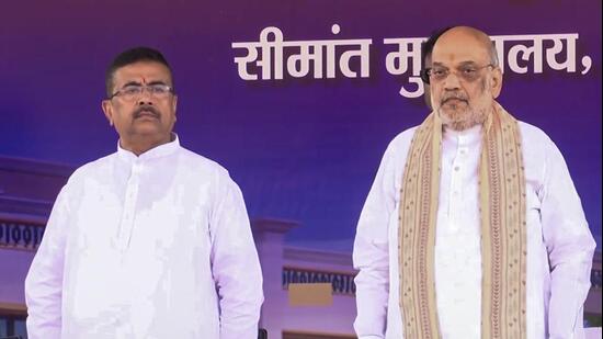 Union home minister Amit Shah and West Bengal chief minister Suvendu Adhikari during the foundation stone laying ceremony of various projects of the Sashastra Seema Bal (SSB), in Siliguri, on Friday. (PTI)