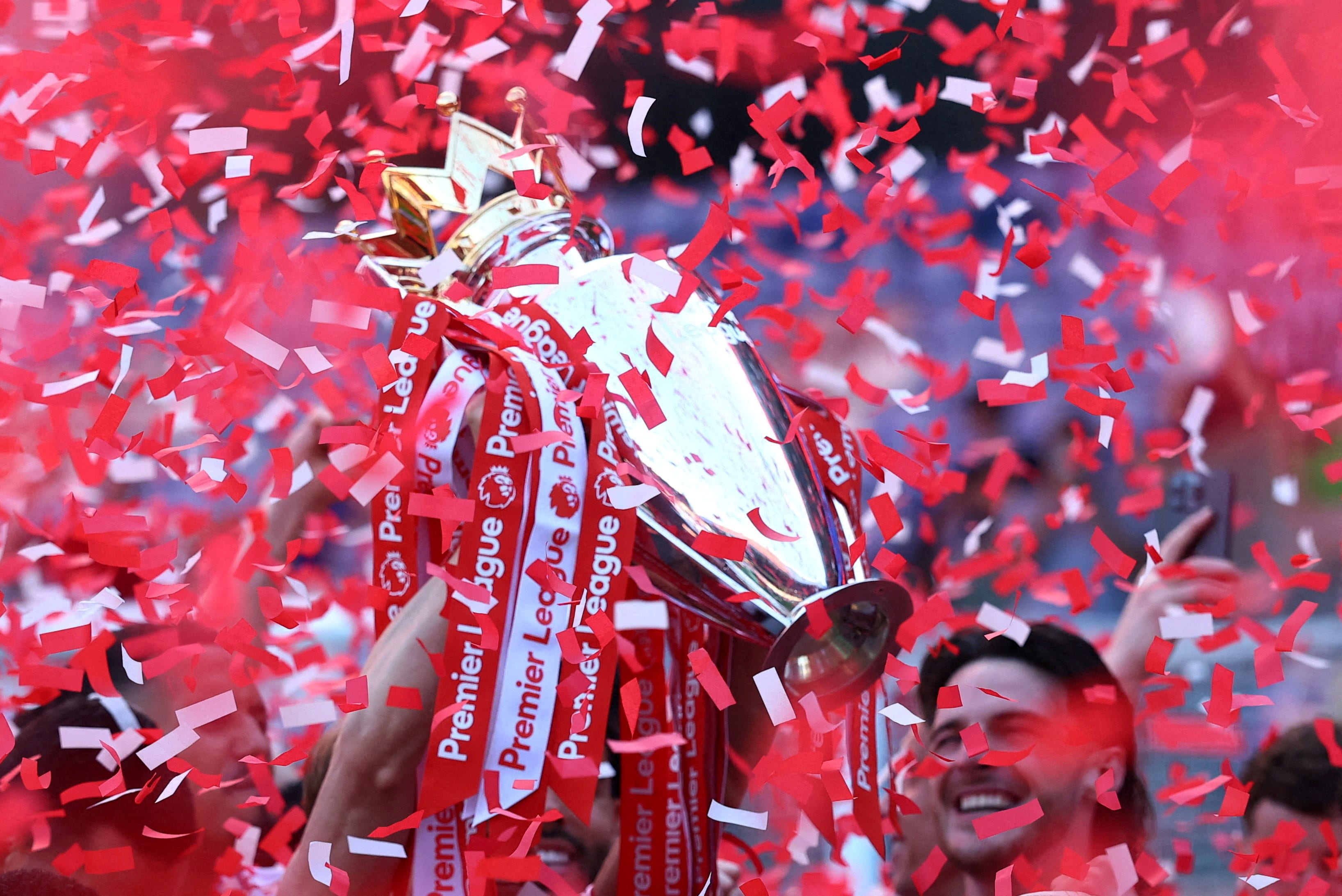 Arsenal’s Martin Odegaard lifts the Premier League trophy as teammates celebrate at Selhurst Park on May 24, 2026. (Action Images via Reuters)
