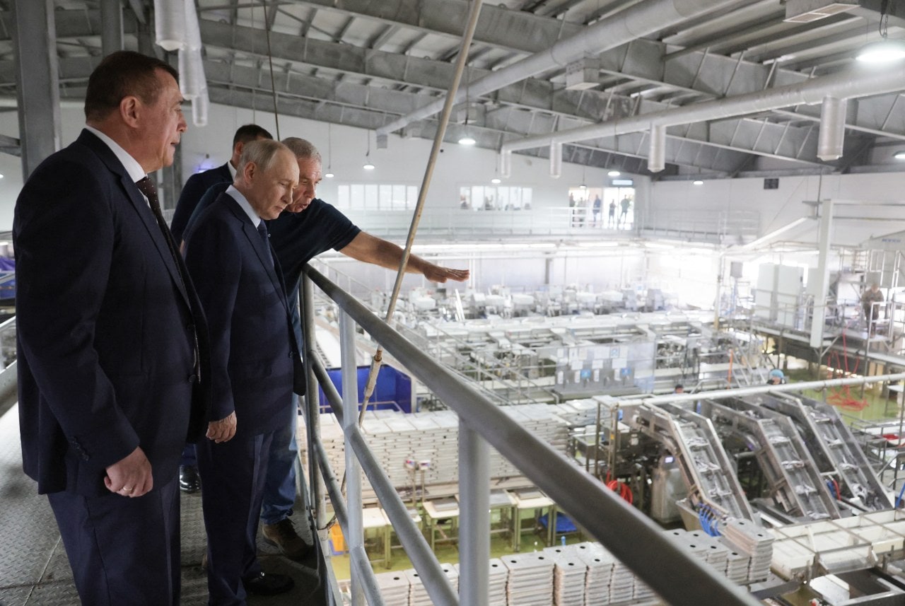 President Putin at a fish processing factory on the disputed island. President Putin at a fish processing factory on the disputed island.