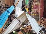 Debris lies in a narrow alley after the wall of an old building collapsed in the Karol Bagh area, in New Delhi on Friday.