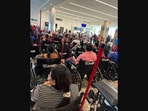 The viral airport picture that has divided the internet. (Screengrab (X))
