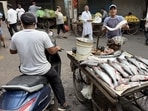 At Chitli Qabar Chowk, street trader Parvez sells fish from a cart stationed at the centre of the square. (HT Photo)