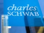 The company logo of Charles Schwab is displayed at a location in the financial district in New York.(REUTERS)
