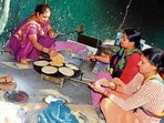 Mid-day meal workers working in a government school in Ludhiana on Friday. (HT PHOTO)