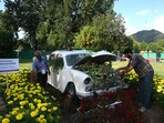 The garden has been established by the floriculture department and more than three dozen discarded items have been used, either by refurbishing them or giving them a useful look. (Waseem Andrabi/HT)