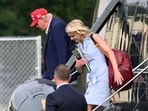 Natalie Harp, dubbed 'human printer' for her pro-Trump article printing, has gained attention for her Ivanka-esque style. (AFP)