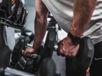 Read to more to find out whether walking after lifting weights burns more fat or not!(Unsplash)