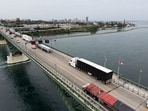 Trucks and other vehicles cross the bridge at the U.S.-Canada border in Fort Erie, Ontario, this week.