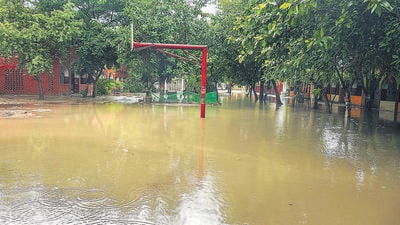 A basketball court at a government school in Kadipur, Gurugram, remained waterlogged on Saturday morning. (Parveen Kumar/HT Photo) A basketball court at a government school in Kadipur, Gurugram, remained waterlogged on Saturday morning. (Parveen Kumar/HT Photo)