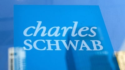The company logo of Charles Schwab is displayed at a location in the financial district in New York. (REUTERS)
