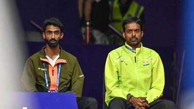 Indian badminton coach Pullela Gopichand, along with B. Sumeeth Reddy, watches the women’s doubles quarterfinal match between India’s Treesa Jolly and Gayatri Gopichand Pullela and China’s Jia Yi Fan and Zhang Shu Xian during the BWF World Championships 2026 in New Delhi, India, on Friday, August 21, 2026. (Photo by Sanchit Khanna/Hindustan Times) (Hindustan Times)
