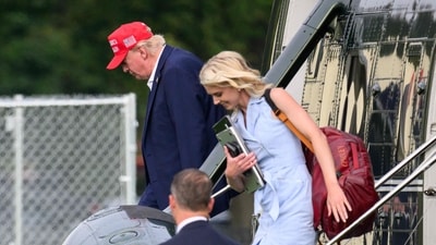 Natalie Harp, dubbed 'human printer' for her pro-Trump article printing, has gained attention for her Ivanka-esque style. (AFP) Natalie Harp, dubbed 'human printer' for her pro-Trump article printing, has gained attention for her Ivanka-esque style. (AFP)