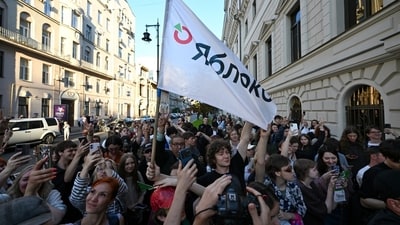 Supporters of Yabloko gather outside a Moscow courthouse during a hearing on the party's election ban.