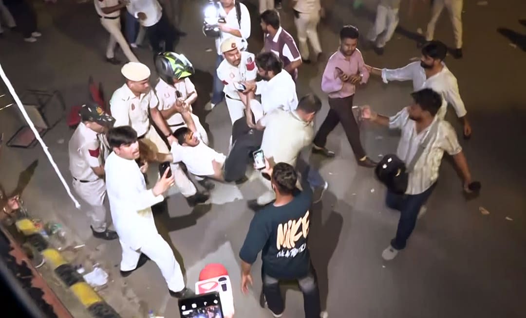 Police detain a protester in New Delhi on Friday. (ANI) Police detain a protester in New Delhi on Friday. (ANI)
