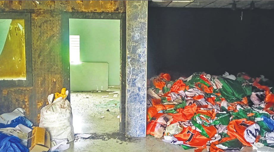 A pile of discarded TMC flags at a party office in Falta. (HT Photo) A pile of discarded TMC flags at a party office in Falta. (HT Photo)