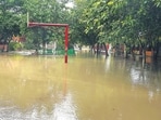 A basketball court at a government school in Kadipur, Gurugram, remained waterlogged on Saturday morning. (Parveen Kumar/HT Photo)