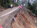 A large section of the Mandi-Pathankot highway sank after heavy rainfall near Mandi on Sunday. The road was closed for heavy vehicles. (Birbal Sharma/HT)