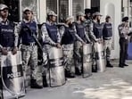 Bangladesh Police personnel stand guard outside the International Crimes Tribunal in Dhaka.