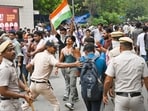 Delhi Police carry out a lathi-charge to disperse supporters of the Cockroach Janta Party (CJP) after they gather in large numbers and breach security barricades near Parliament House on DR Rajendra Prasad Road in New Delhi, India, on Monday, July 20, 2026. (Hindustan Times)