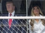 Donald Trump and first lady Melania Trump attend the IndyCar Freedom 250 Grand Prix auto race in Washington DC on Sunday. (AP)
