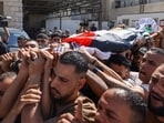 Mourners carry the body of Palestinian Islam Ajouri, 14, at Rafidia Hospital in Nablus in the Israeli-occupied West Bank, on August 23, 2026(AFP)