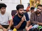Cockroach Janta Party (CJP) founder Abhijeet Dipke addresses a press conference as party spokepersons Saurav Das and Ashutosh Ranka look on, amid the ongoing protest over NEET paper leak issue, at Jantar Mantar.