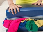 My suitcase finally reflects how I actually travel: comfortable outfits, versatile footwear, fewer gadgets and only the essentials I genuinely use. (canva.com)