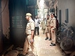 Police inspect the building of the incident in Khoda. (Sakib Ali/HT Photo)