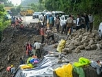 Workers carry out repair work on a damaged retaining wall along the Dehradun-Mussoorie road, at Paniwala Band, in Mussoorie, Uttarakhand, Saturday, Aug. 22, 2026.