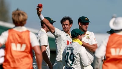 Mitchell Starc (C) celebrates with teammates after taking his tenth wicket for the match of Bangladesh's Taijul Islam during the second day of the second Test match (AFP)