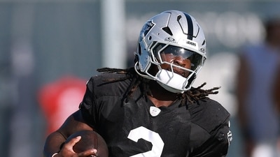 Ashton Jeanty was helped from the field after appearing to suffer an injury during the closing stages of Sunday’s practice. (Getty Images via AFP)