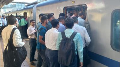 Mumbai, India - October 03, 2022: Scores of commuters stranded at the Borivali station as they had a harrowing time on Monday morning, the first day of revised air-conditioned local services on the Western line. Commuters struggle to board the packed AC local train on Monday at 7.45am from Borivali station. It was only after the police intervened and asked a few commuters to alight did the train move. (HT Photo) (Hindustan Times) Mumbai, India - October 03, 2022: Scores of commuters stranded at the Borivali station as they had a harrowing time on Monday morning, the first day of revised air-conditioned local services on the Western line. Commuters struggle to board the packed AC local train on Monday at 7.45am from Borivali station. It was only after the police intervened and asked a few commuters to alight did the train move. (HT Photo) (Hindustan Times)