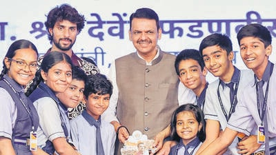 Nagpur, Aug 23 (ANI): Maharashtra Chief Minister Devendra Fadnavis in a group photo with school students at the valedictory program of ‘Manthan4Yuva’, in Nagpur on Sunday. Cricketer Tilak Varma also present. (@CMOMaharashtra X/ANI Photo) (@CMOMaharashtra)
