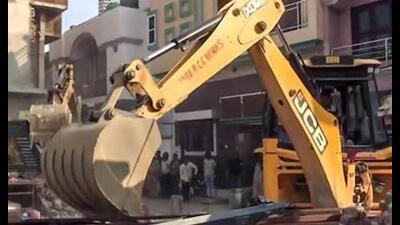 The madrasa committee brought in a bulldozer and started removing the alleged illegal construction. (For Representation) The madrasa committee brought in a bulldozer and started removing the alleged illegal construction. (For Representation)