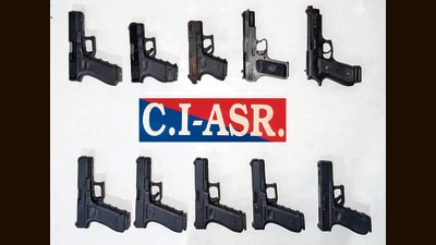 The recovered weapons include nine 9mm pistols and one .30-bore pistol. (HT)