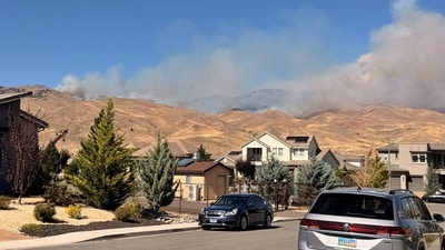 Smoke rises during wildfire in Reno, Nevada, U.S., in this picture taken from social media. (Natalie Wainwright via REUTERS)