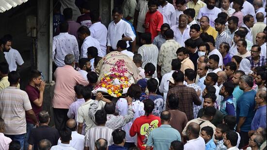 Relatives and friends gather at Chandanwadi Crematorium for the funeral of Sanket Nevashe, president of the Bhuleshwar Cha Raja Ganpati Mandal, who was among the two people killed after the 22-foot Ganpati idol collapsed. (Photo by Anshuman Poyrekar/Hindustan Times) (Anshuman Poyrekar/HT Photo)