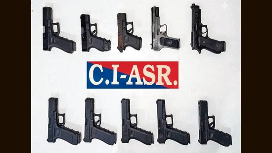 The recovered weapons include nine 9mm pistols and one .30-bore pistol. (HT)