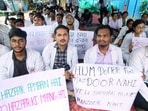 MBBS interns of King George's Medical University (KGMU) hold placards during a protest to demand an increase in their monthly internship stipend from <span class='webrupee'>₹</span>12,000 to <span class='webrupee'>₹</span>30,000 at the KGMU premises, in Lucknow on Saturday.