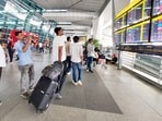 People wait outside the departure terminal at Indira Gandhi International (IGI) Airport, in New Delhi, on Friday.(HT/ representational)