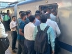 Mumbai, India - October 03, 2022: Scores of commuters stranded at the Borivali station as they had a harrowing time on Monday morning, the first day of revised air-conditioned local services on the Western line. Commuters struggle to board the packed AC local train on Monday at 7.45am from Borivali station. It was only after the police intervened and asked a few commuters to alight did the train move. (HT Photo) (Hindustan Times)